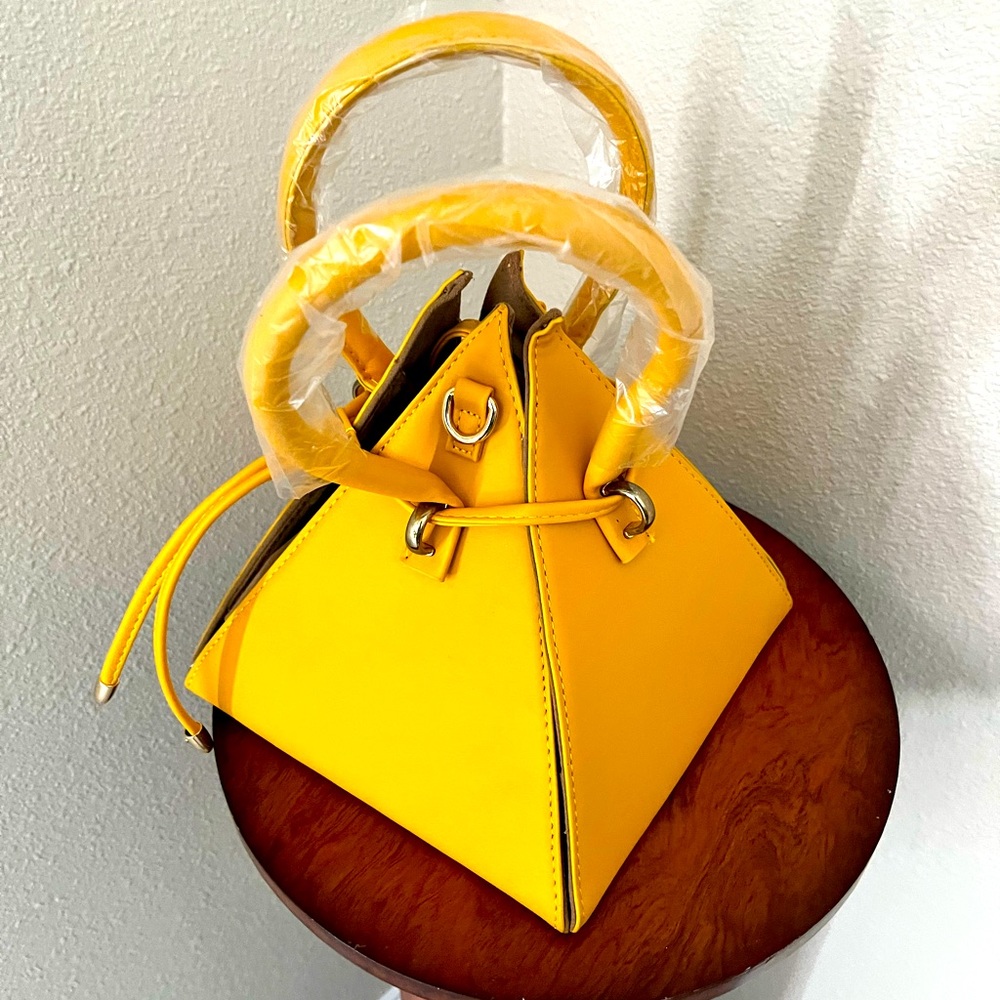 Yellow triangle shape hand bag